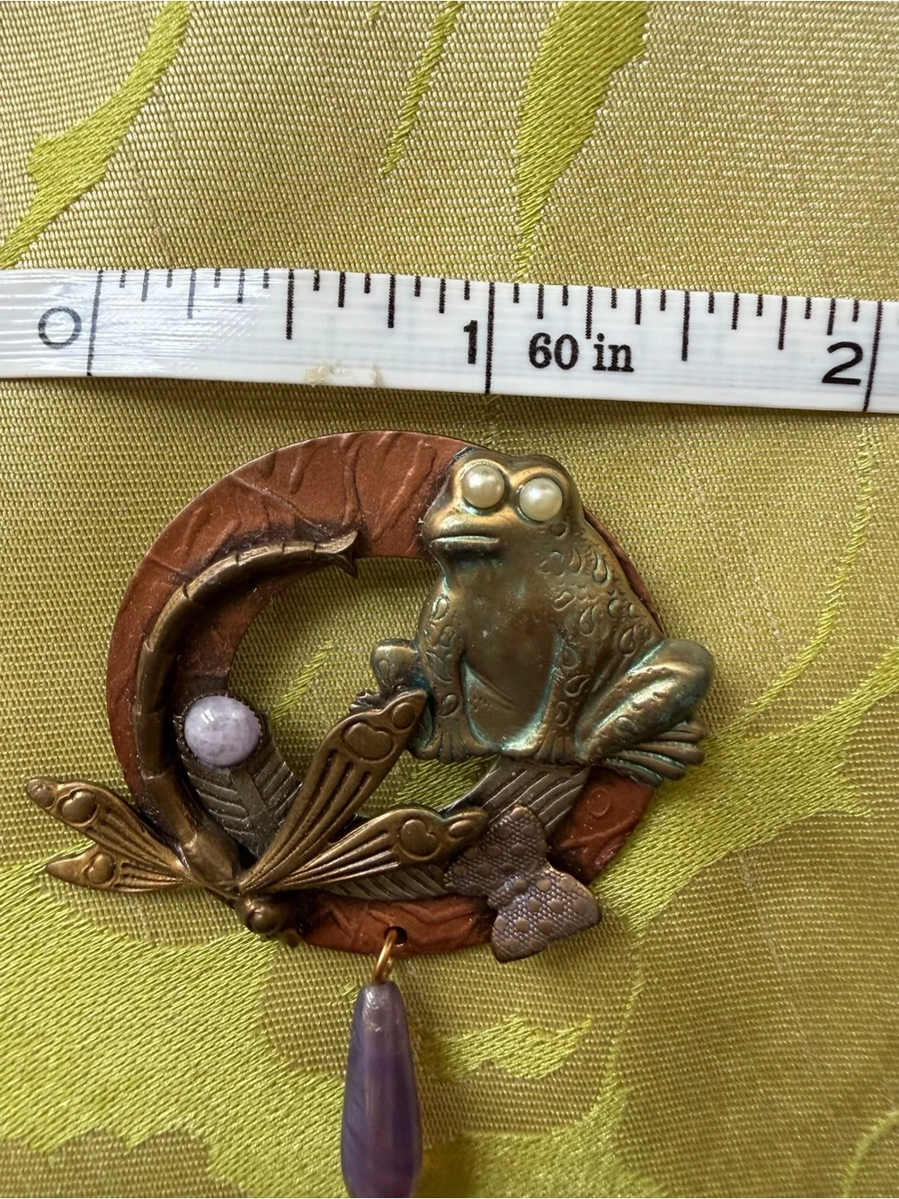 Brooch with whimsical frog and dragonfly on wreath in mixed metals. See photos